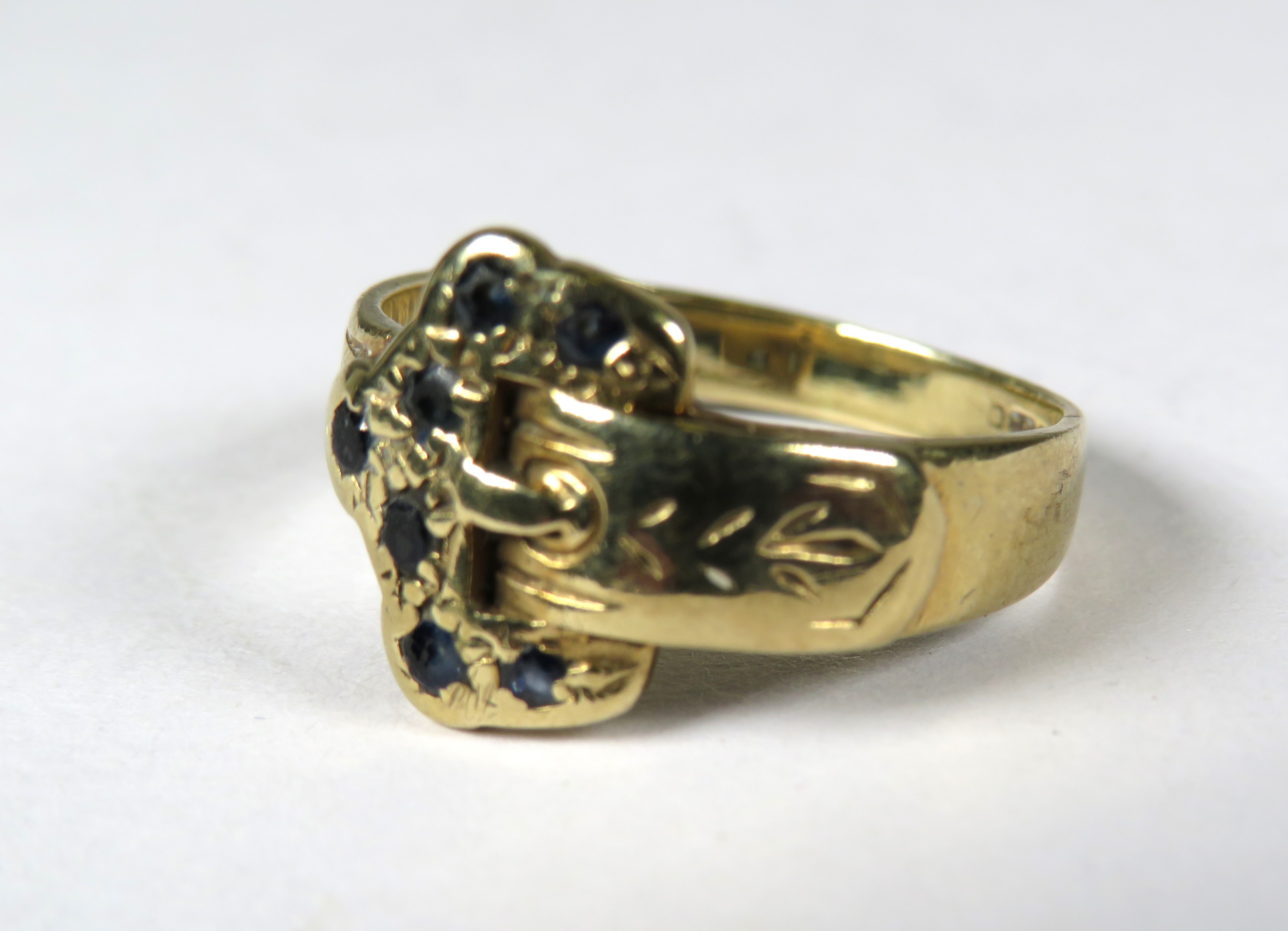 9ct Yellow Gold Belt Buckle Ring set with (worn) sapphires.   Finger size 'J'     2.3g