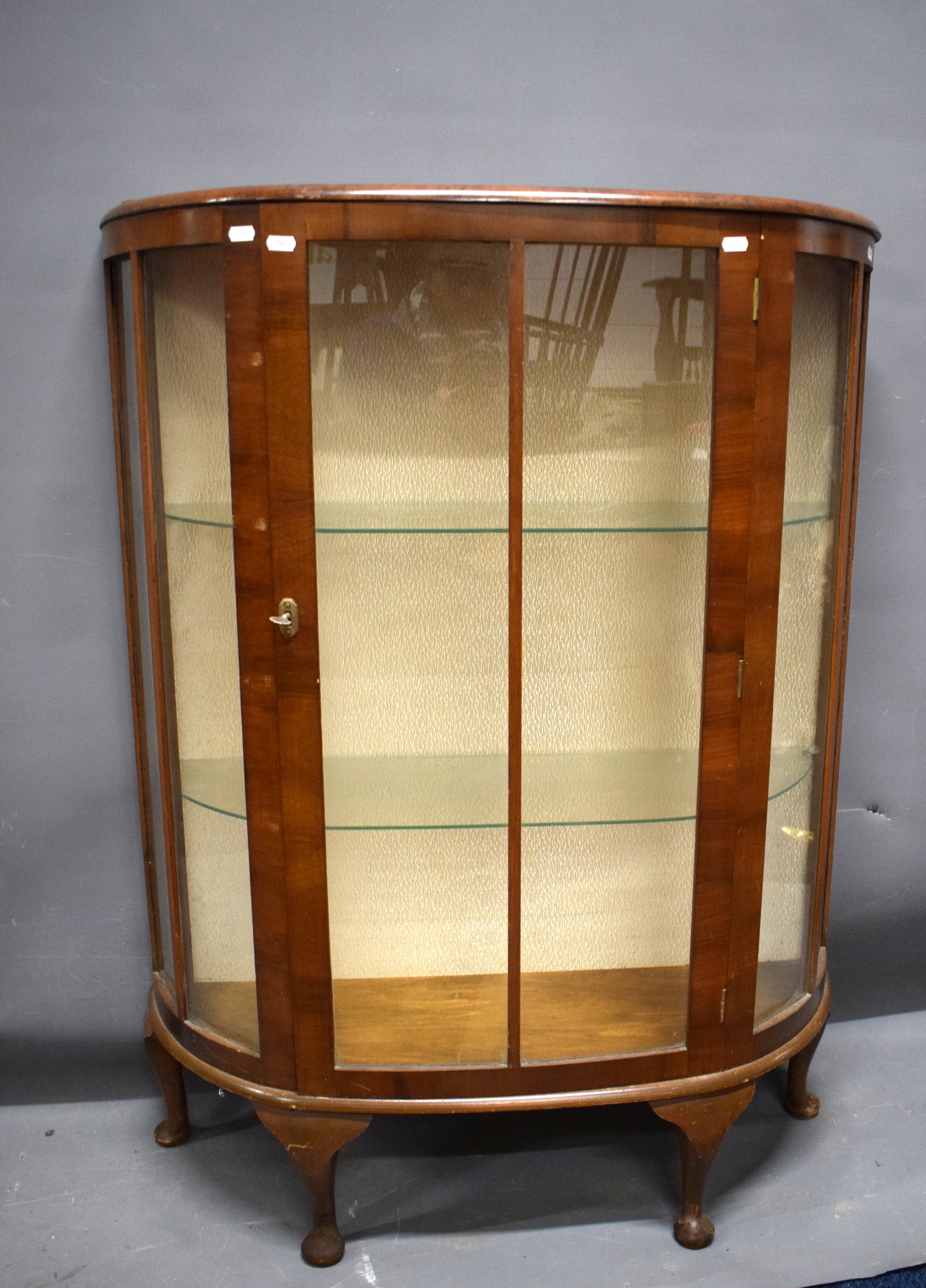 Vintage Bow Fronted China Cabinet with two curved glass shelves. Locks with Key..  Measures approx H