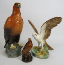 Large Beswick Scotch Whiskey Bald Eagle decanter, plus a small one and a Sylvac Osprey figurine.