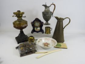 Interesting mixed lot included a Oil lamp, Vintage ceramic clock, hammered brass jug etc.