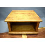Square Oak Coffee Table raised on bun feet. Measures approx H:16 x W:27 x D: 27 inches. See photos. 