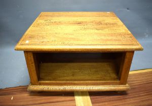 Square Oak Coffee Table raised on bun feet. Measures approx H:16 x W:27 x D: 27 inches. See photos. 