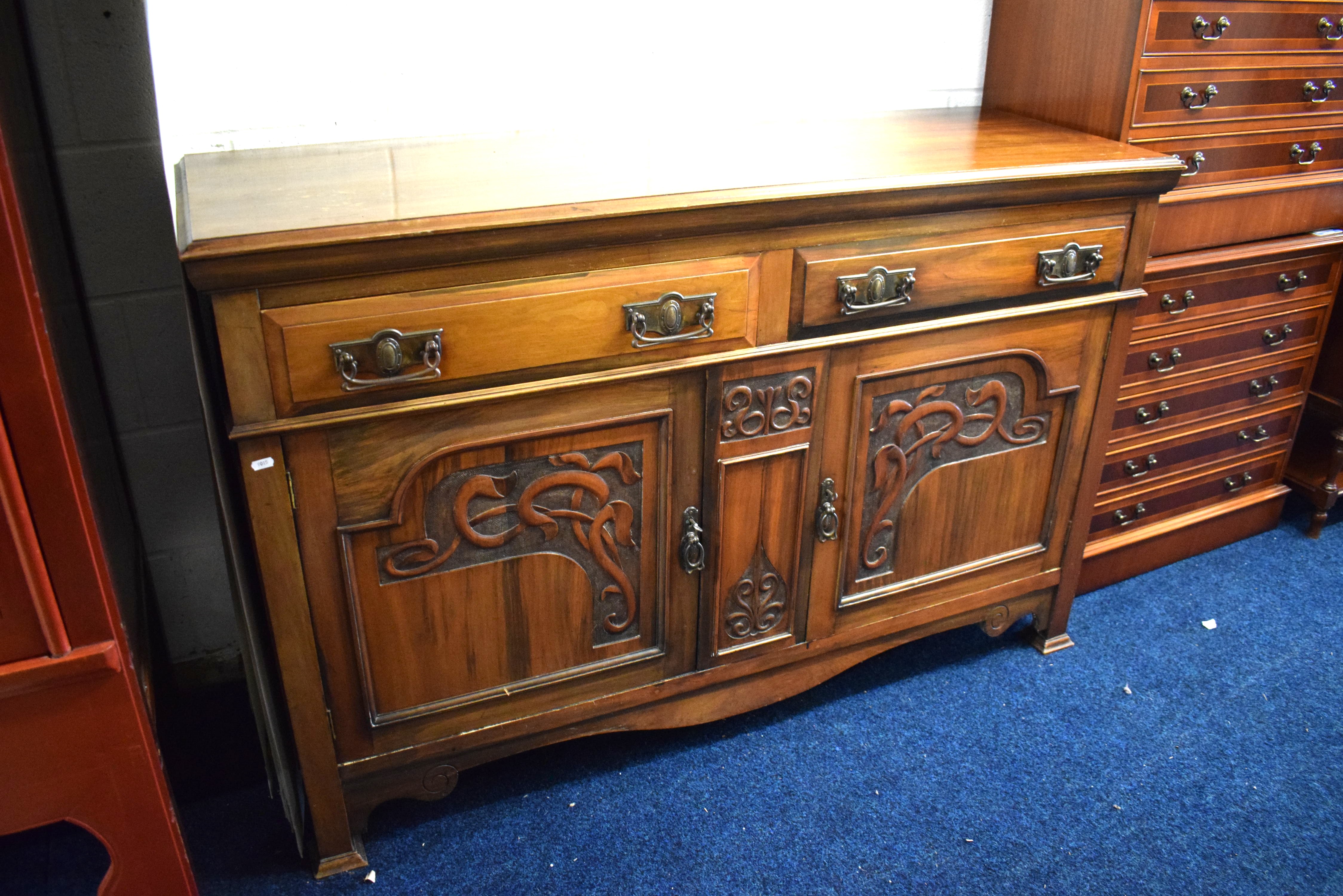 Large buffet cabinet with carving decoration to front. Two drawers above cupboards.  See photos. 
