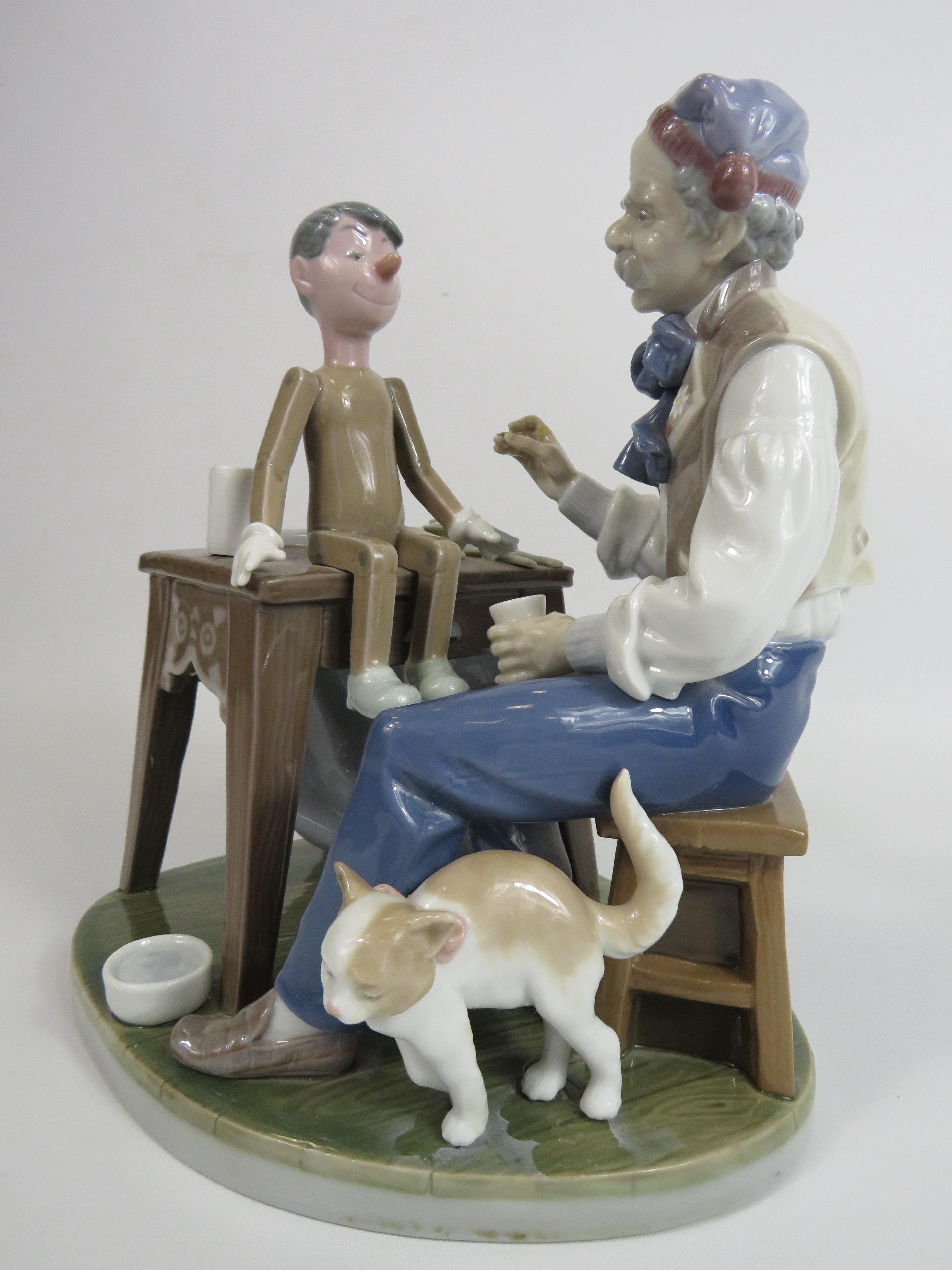 Lladro figurine The puppet painter Geppetto & Pinocchio Model no 5396, (Missing paint brush and