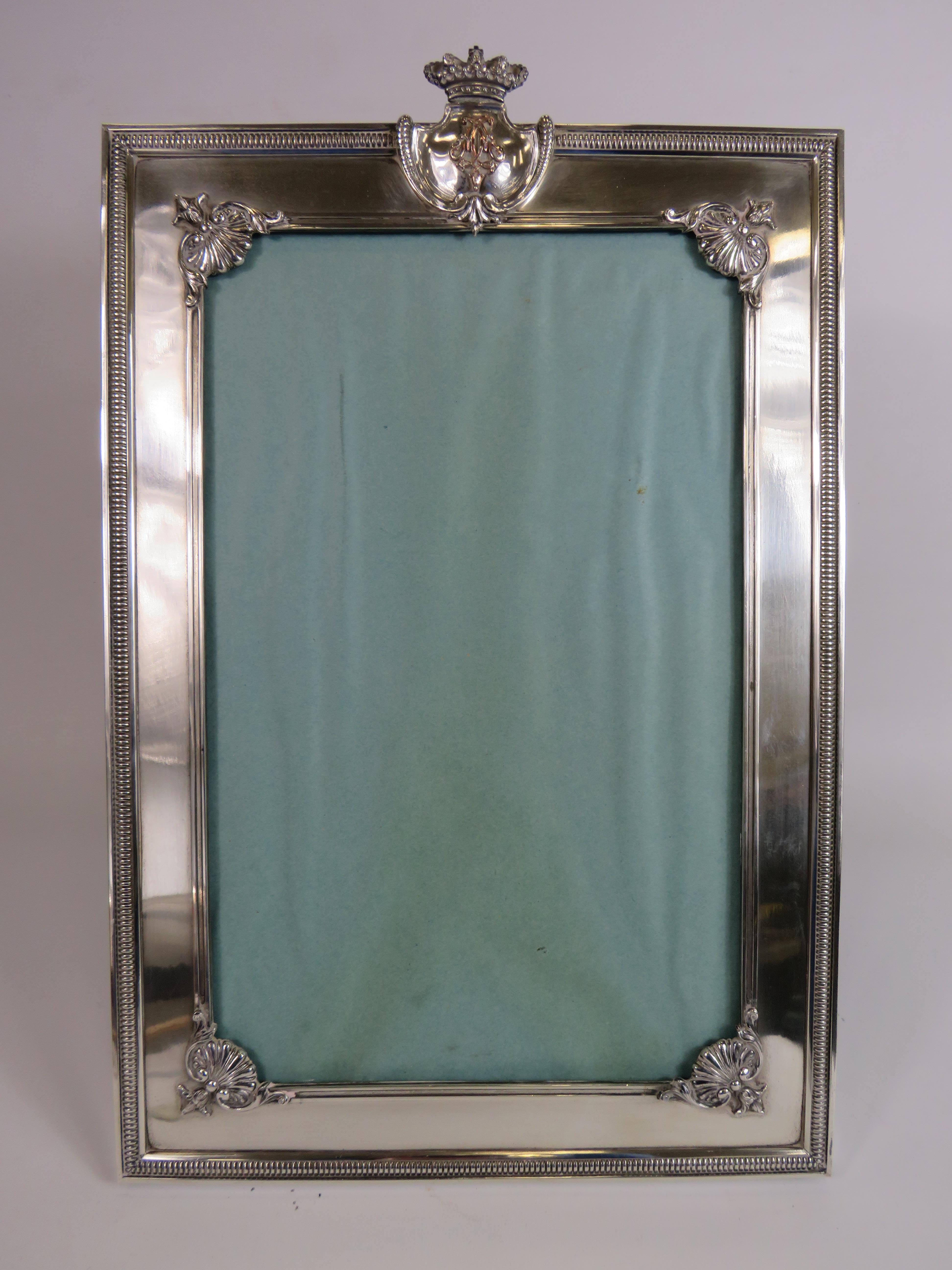 Large silver plated picture frame, 17" by 11.5". Requires new glass.