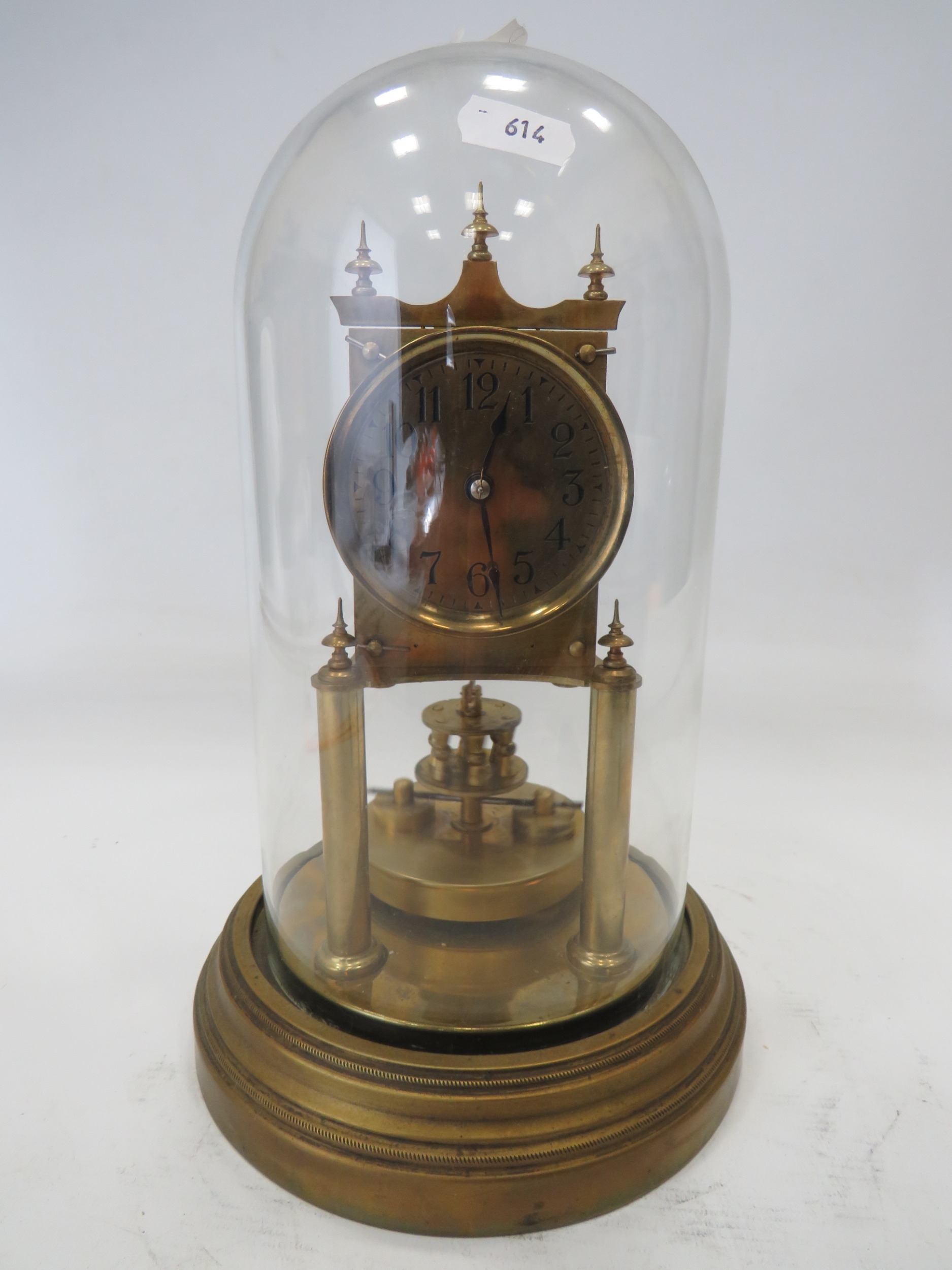 Brass Based Anniversary clock under a Glass Dome which measures approx 11 inches tall. Makers Mark