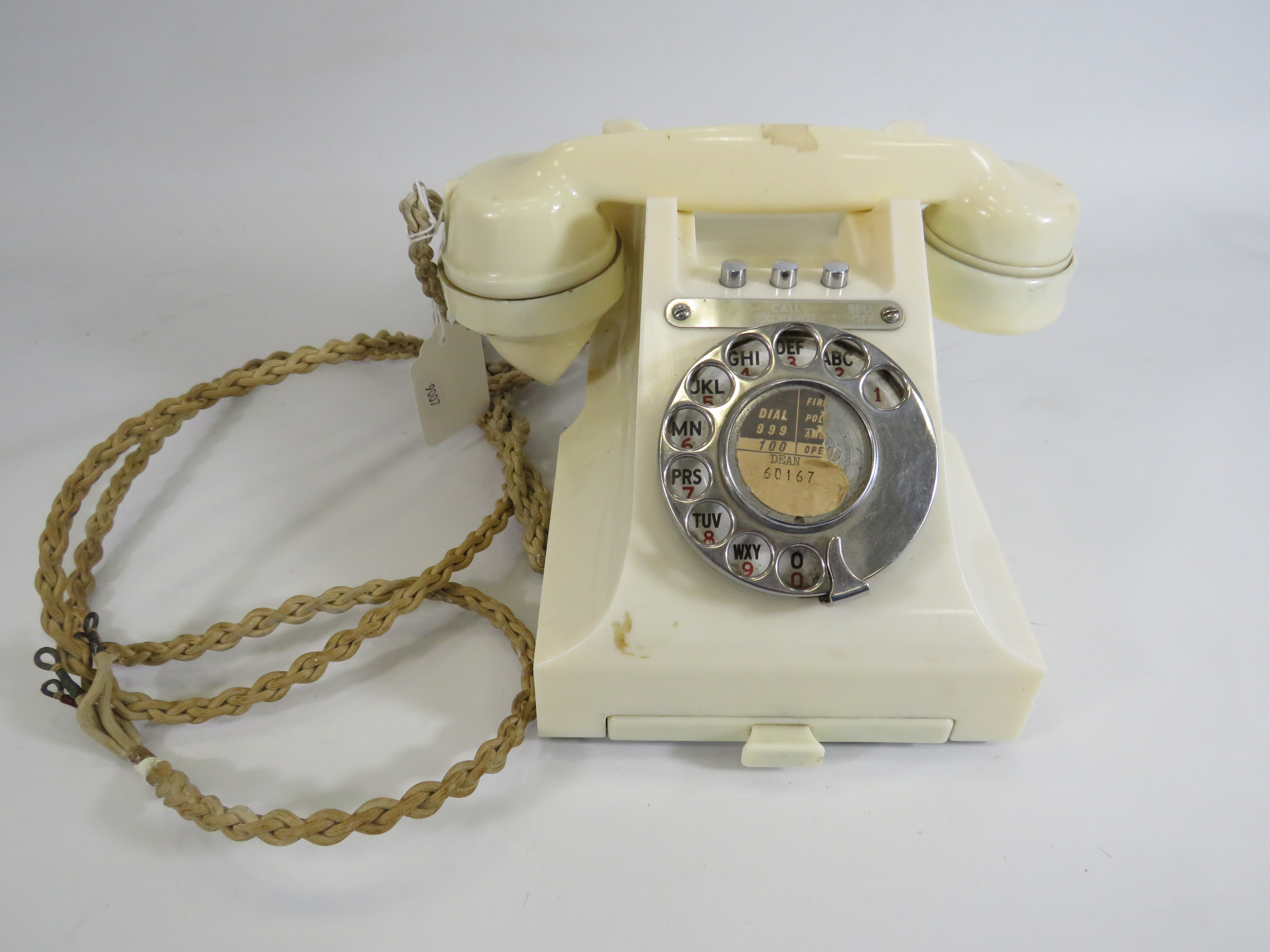 Vintage GPO white bakelite dial around telephone.