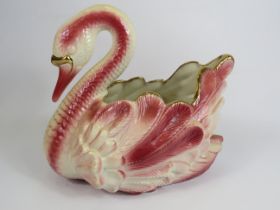 Large Staffordshire pink and gold ceramic swan planter, 31cm tall and 33cm long.