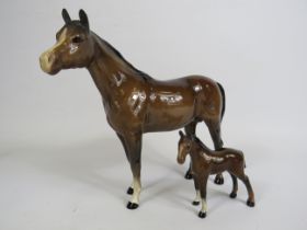 Beswick bay horse and matching foal.