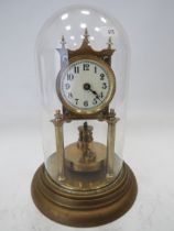 German Made Brass based Anniversary clock with enamel Dial. Sits under a Glass dome which measures