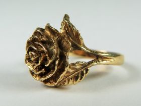 Unmarked ring (chem testing 9ct or higher) in a sculpted rose design. Finger size 'K' 4.5g