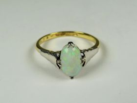 18ct Yellow Gold ring set with a lovely Oval Opal supported by Platinum shoulders. Finger size 'P'