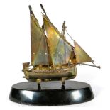 Pretty Silver Model of a Two masted Sailing boat raised on an Ebonised Plinth.  Imported 925 Hallmar