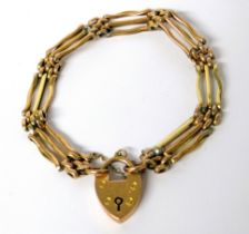 9ct Yellow Gold Three Bar Gate Bracelet with heart shaped padlock clasp, safety chain fitted. 10.7g