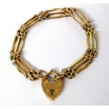 9ct Yellow Gold Three Bar Gate Bracelet with heart shaped padlock clasp, safety chain fitted.  10.7g