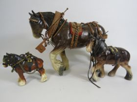 Three vintage ceramic shire horses with harnesses the tallest stand 25cm.