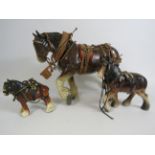 Three vintage ceramic shire horses with harnesses the tallest stand 25cm.
