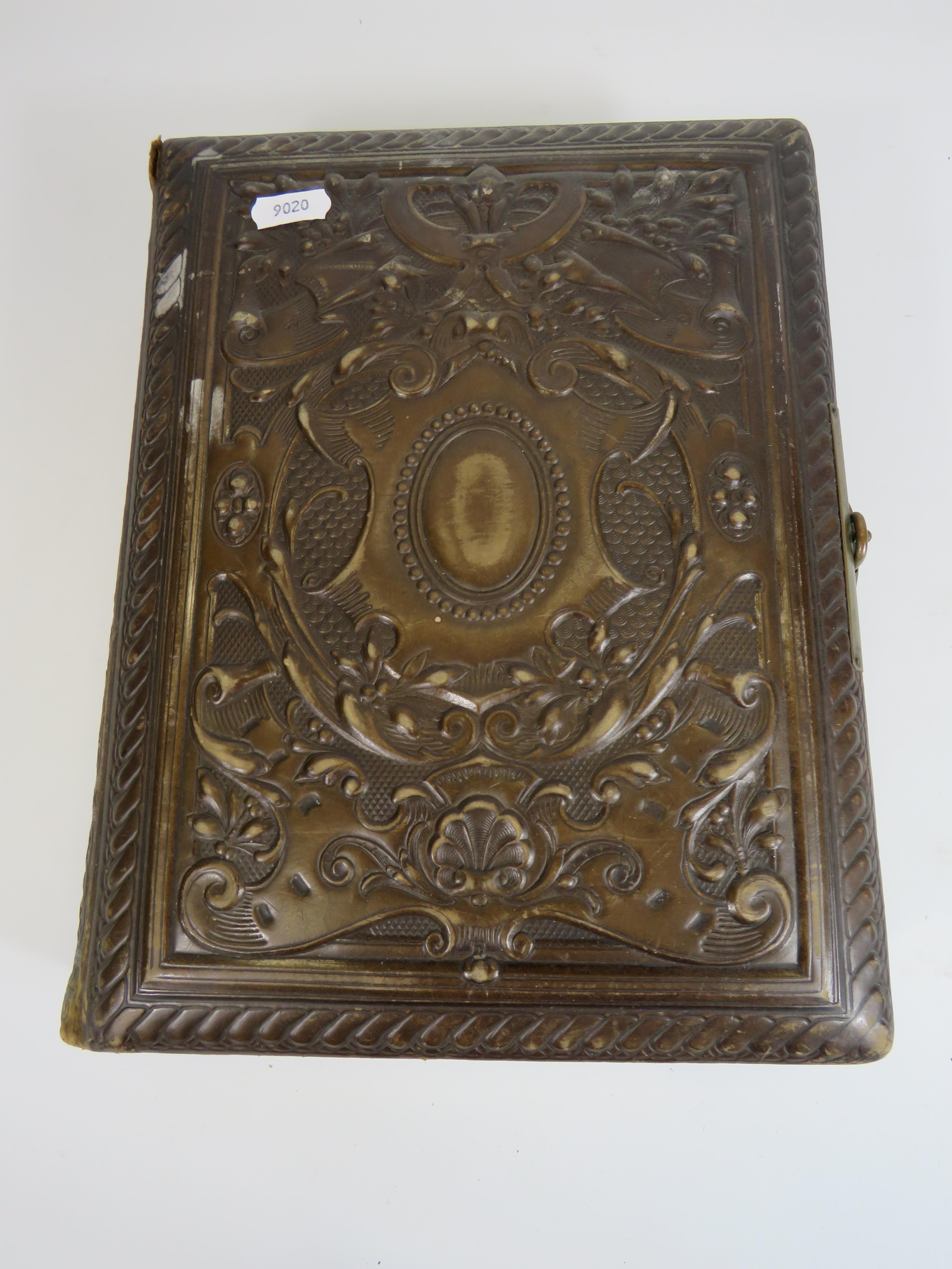 Antique leather photo album and a selection of antique photos,