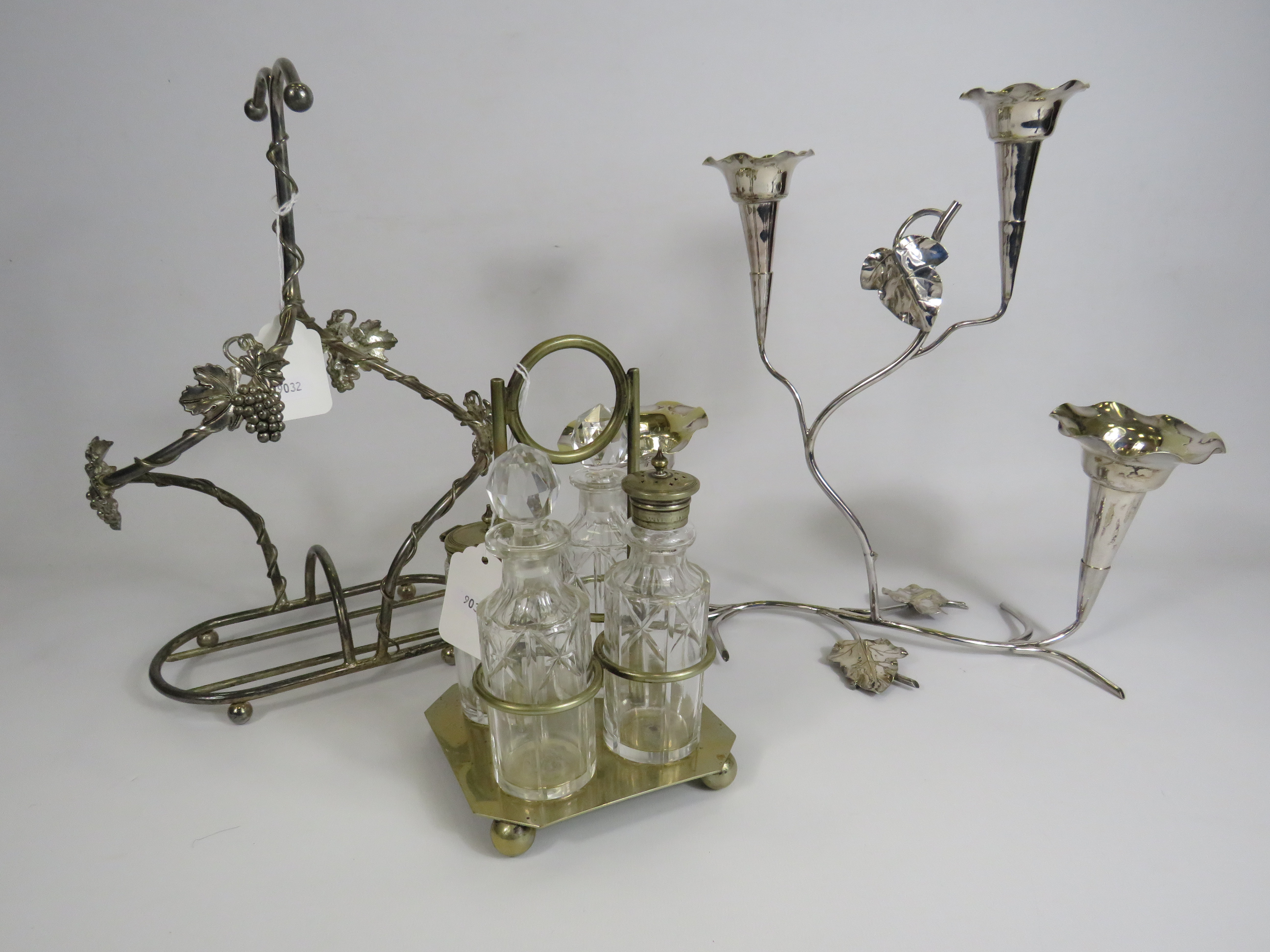 Silver plated cruet set, Epergne vase and a white metal bottle holder.