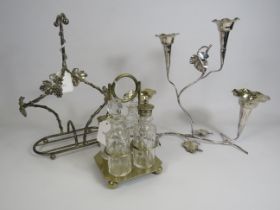 Silver plated cruet set, Epergne vase and a white metal bottle holder.