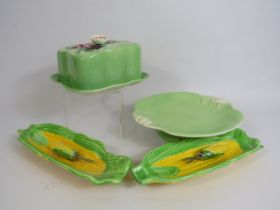 Beswick art deco butter dish, Royal Winton cake plate and Two corn on the cob dishes with forks.