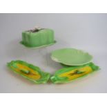 Beswick art deco butter dish, Royal Winton cake plate and Two corn on the cob dishes with forks.