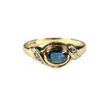 9ct Yellow Gold Ring set with a central Oval Topaz with Diamonds to shoulders.  Finger size 'O'   1.