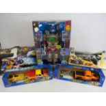 Selection of boxed childrens toys including a robot and remote control vehicle.