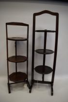 Two Early 20th Century folding wooden cake stands. Approx 38 inches tall. See photos. S2