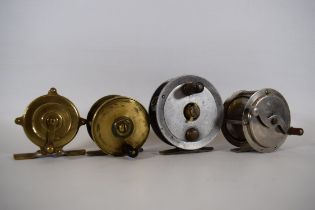 Four Fly Fishing reels of steel, brass and aluminium. See photos.