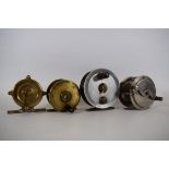 Four Fly Fishing reels of steel, brass and aluminium. See photos. 