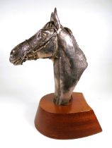 Beautifully Sculpted Horses Head in filled Hallmarked Silver . Bears the signature D. Gernty.