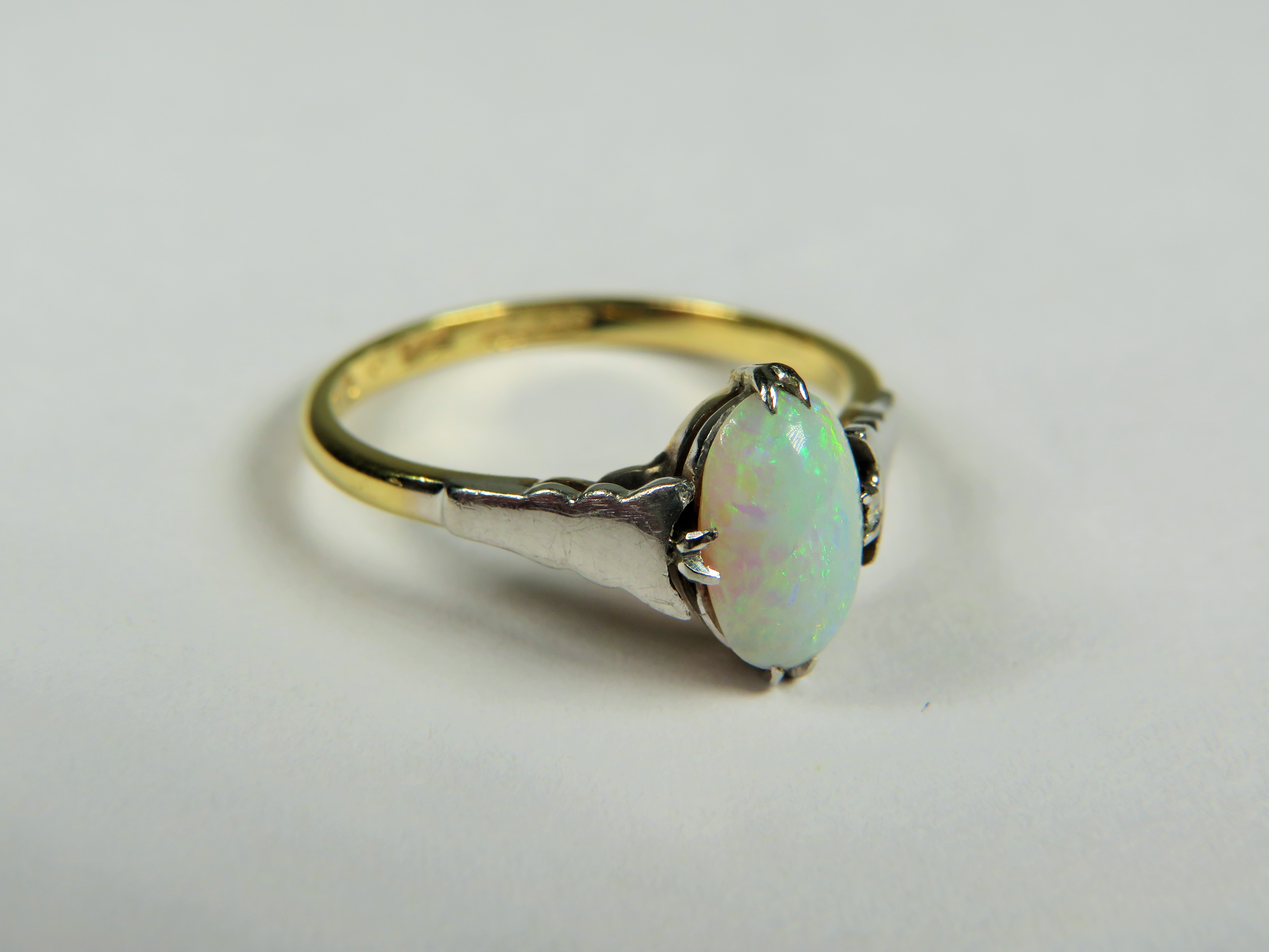 18ct Yellow Gold ring set with a lovely Oval Opal supported by Platinum shoulders.  Finger size 'P'  - Image 2 of 3