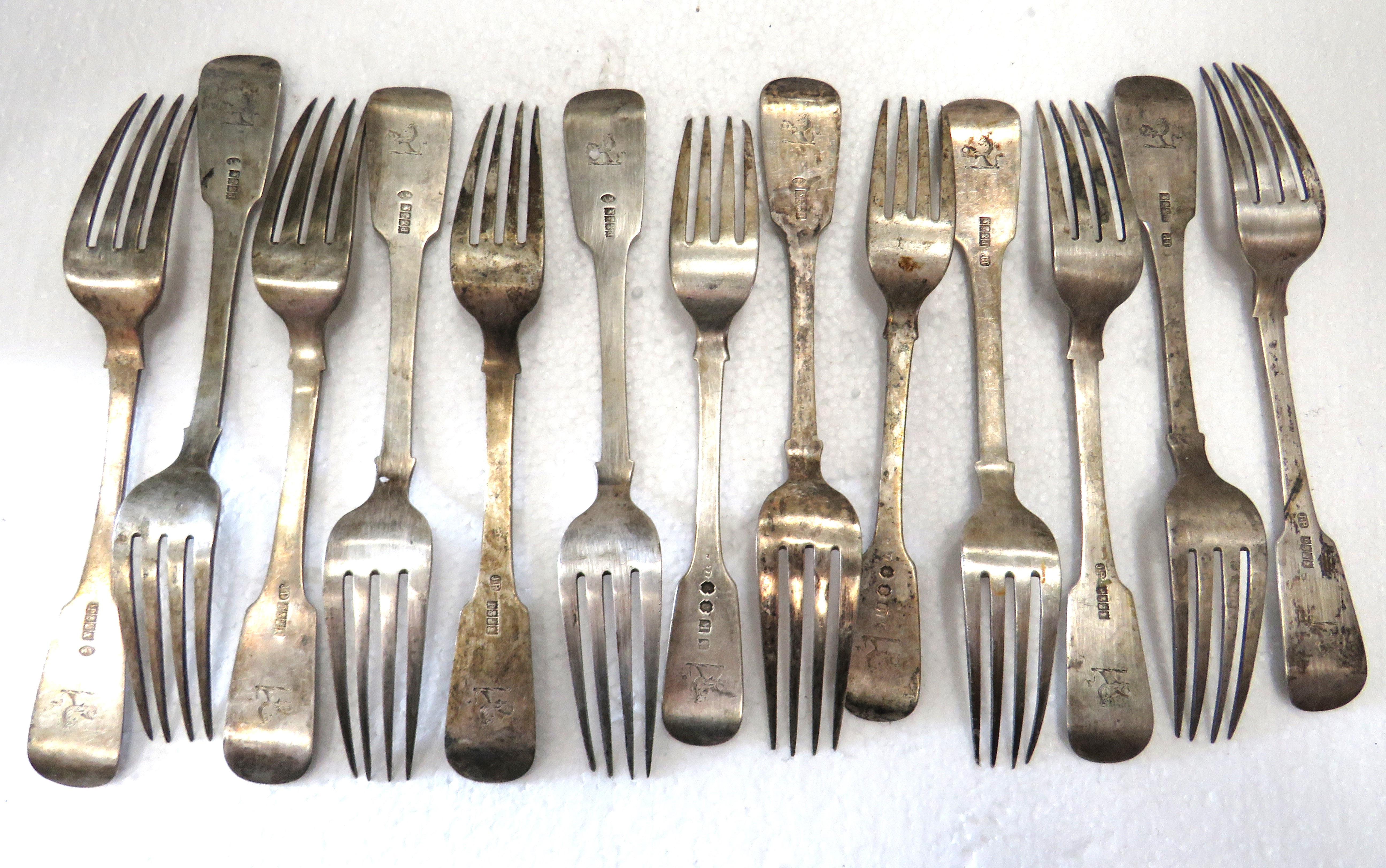 Selection of Antique Georgian Irish Silver Forks with Dublin Hallmarks and armorial crests .  Total 