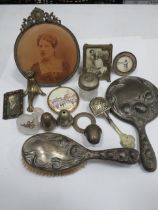 Mixed lot of curios to include photo frames, cruets, Pewter backed brush & Mirror. See photos.