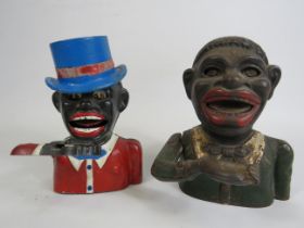 Two Vintage cast iron Jolly man money boxes.