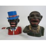 Two Vintage cast iron Jolly man money boxes.