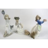 3 Nao figurines of girls with puppies the tallest stand 22cm.