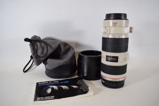 Canon EF 70/200mm Lens F/4L   Complete with Bags , lens caps and instruction manual. See photos. 