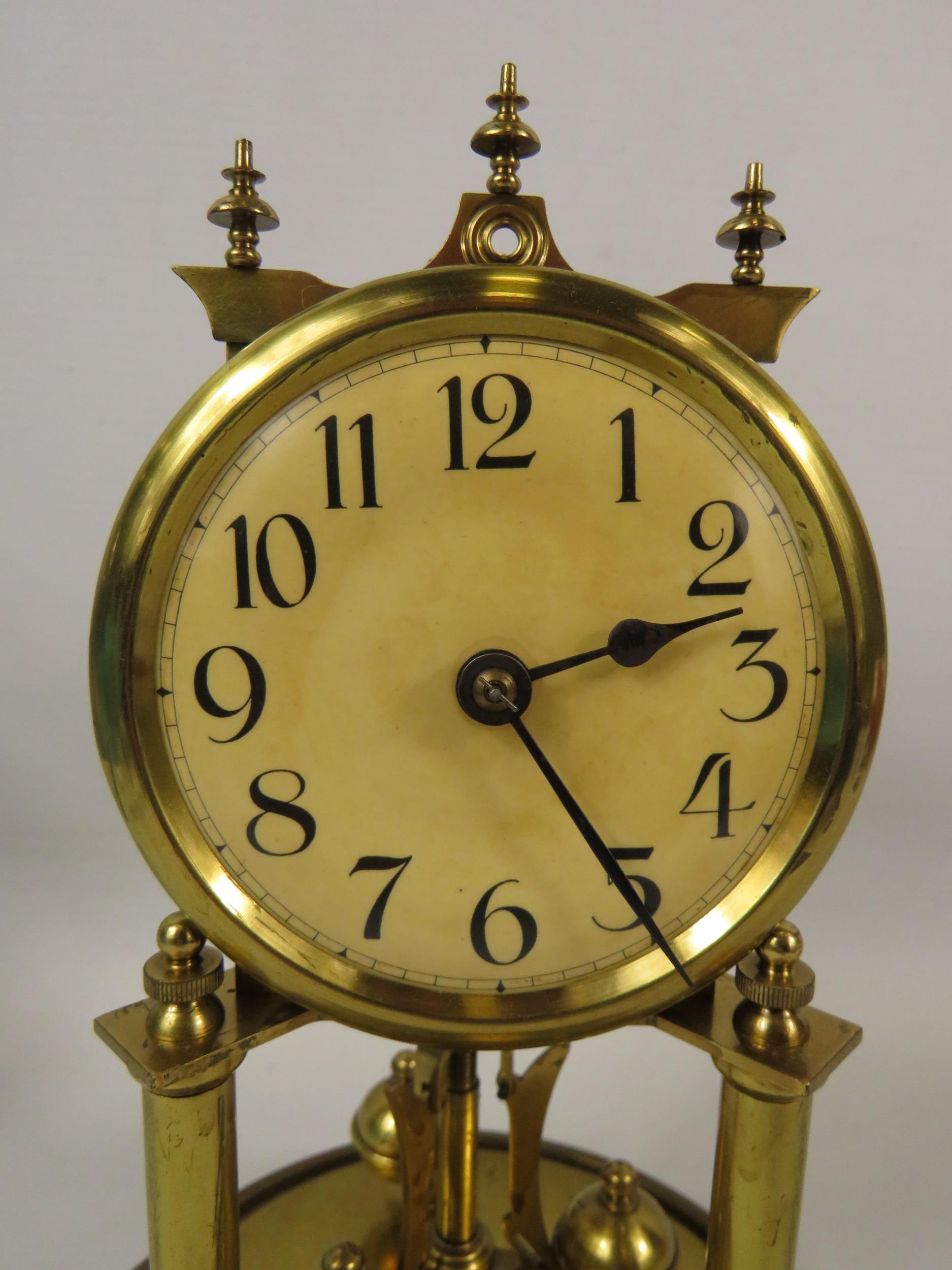 German Made Brass based Anniversary clock with enamel Dial. Sits under a Glass dome which measures - Image 2 of 4