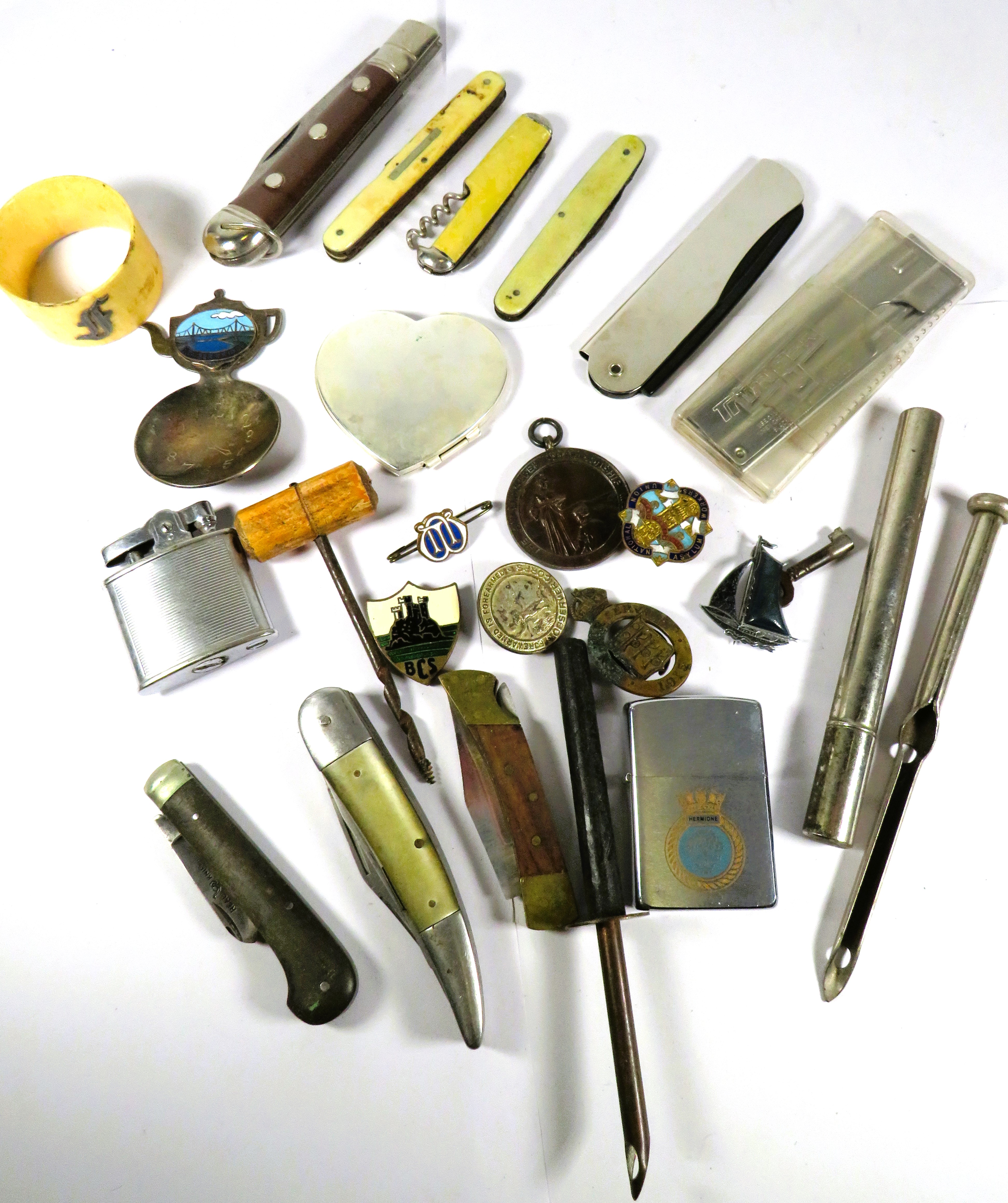 Mixed lot of treasures to include penknives, 1951 Winterton Show medal, Zippo Lighter HMS Hermione. 