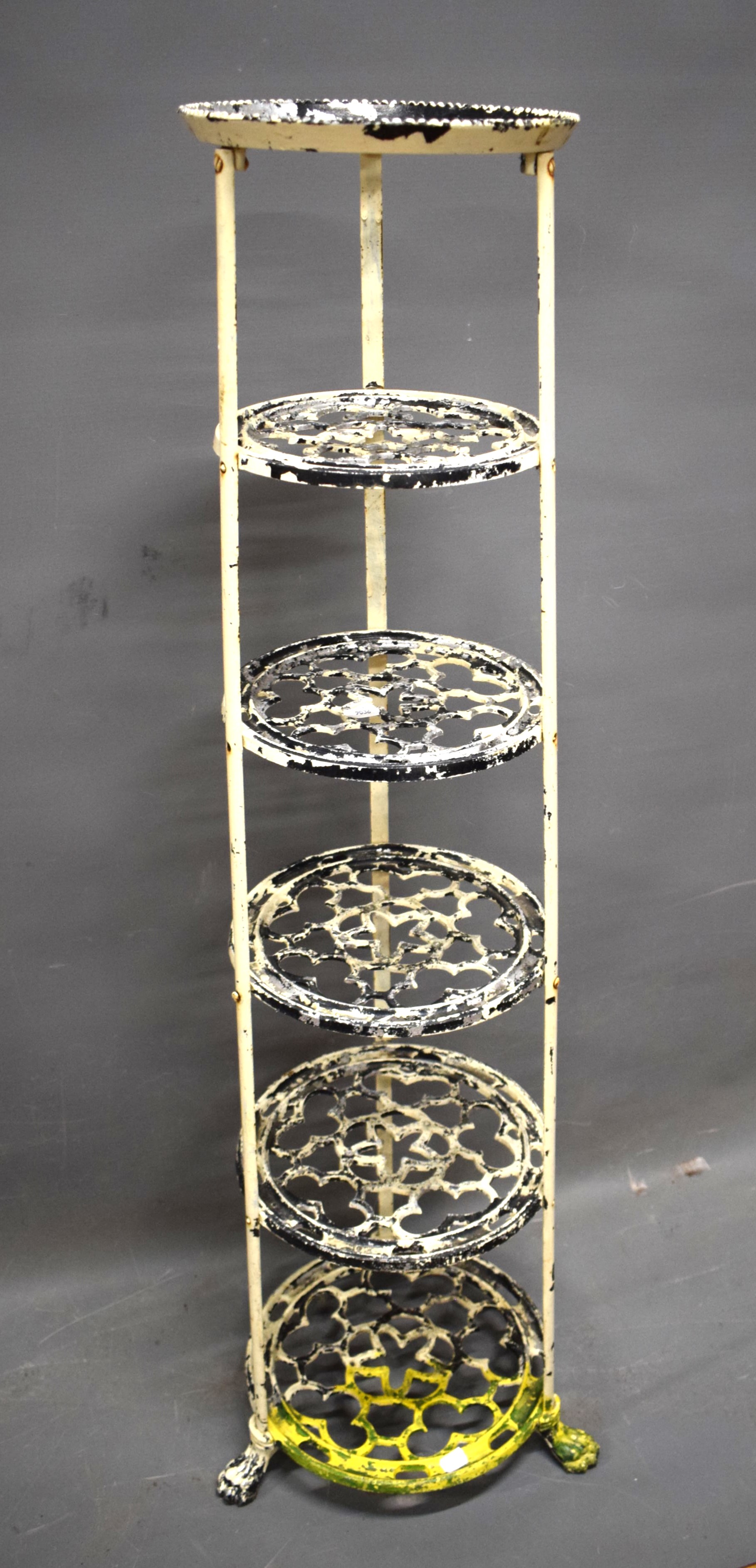 Five tier aluminium plant/pan stand raised on paw feet. Measures approx H:48 tall.  See photos. 