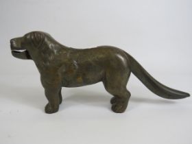 Cast brass nut cracker in the form of a dog , 31cm long and 13cm tall.