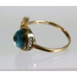 Unusual 9ct Yellow Gold Ring set with circular Aqua with Diamonds to moon segment and sides of Aqua 