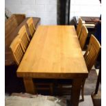 Heavy Oak Table of good quality and finish. Comes with six chairs with shaped backs,.   See photos. 