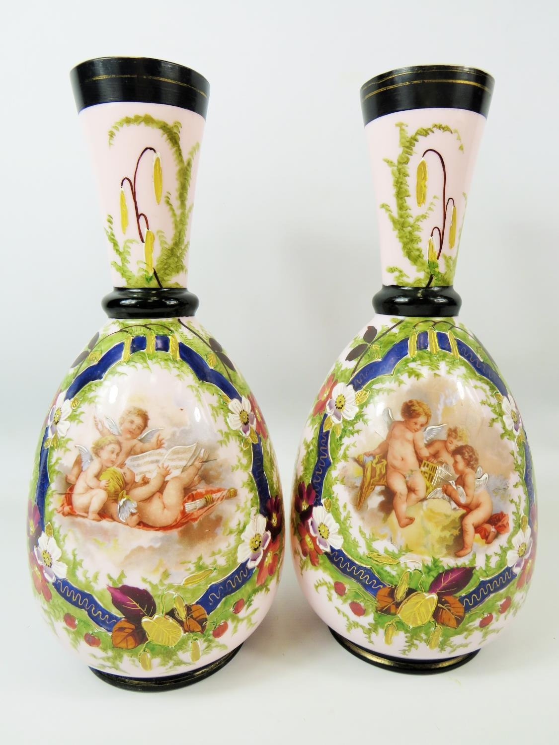 Pair of Milk Glass Vases which have transfer print and hand applied decoration showing cherubs. Each