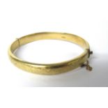 9Ct Yellow Gold etched Bangle with safety chain fitted. Weight 11.8g