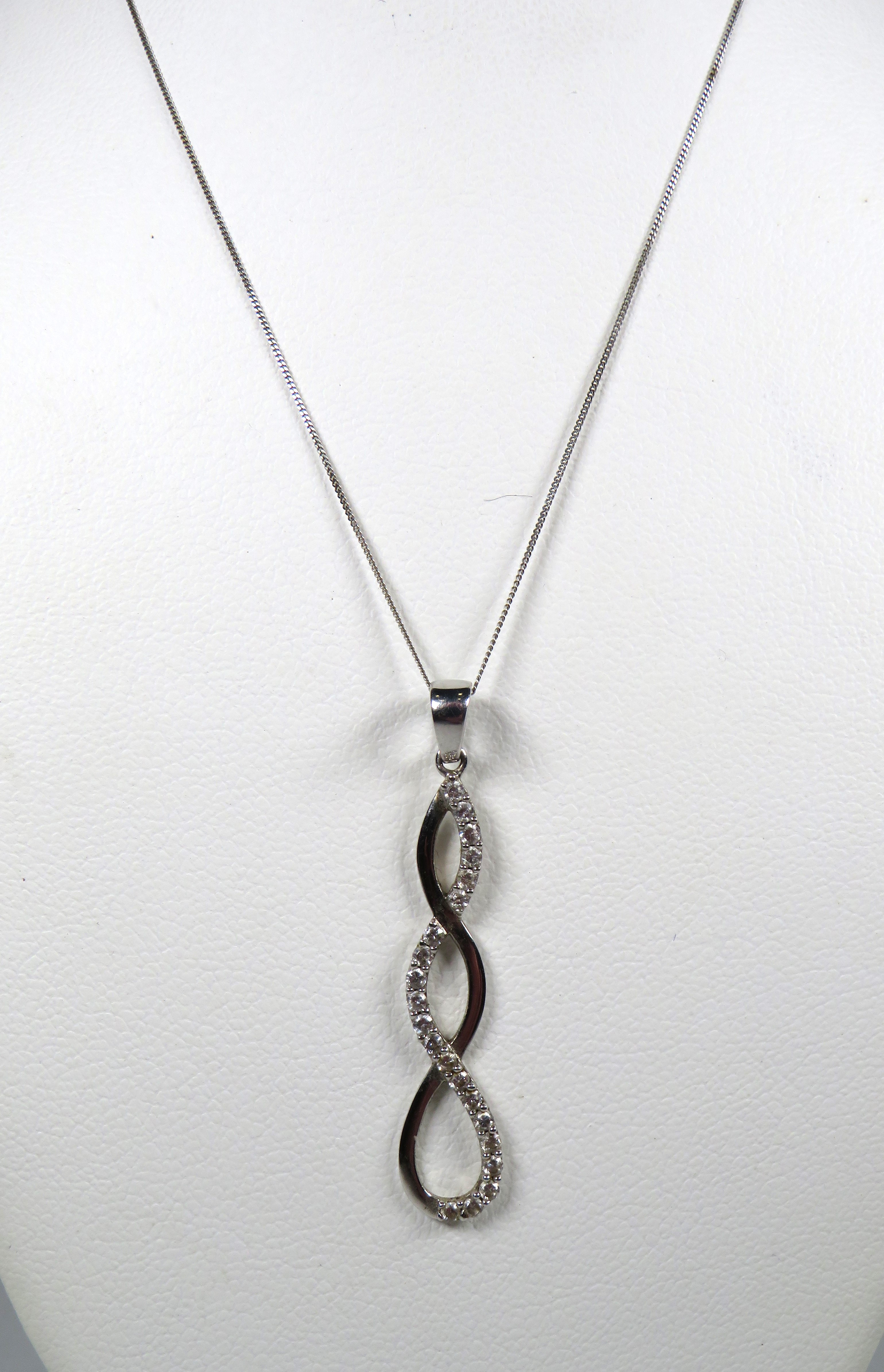 9ct White Gold CZ set Helix twist pendant set on an 18 inch White Gold chain.  Total weight 1.6g