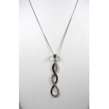 9ct White Gold CZ set Helix twist pendant set on an 18 inch White Gold chain.  Total weight 1.6g