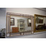 Modern metal framed mirror  which measures approx 38 x 27 inches. See photos.  S2